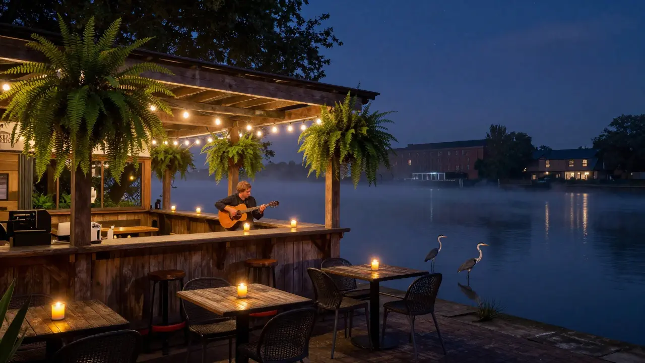 A riverside bar at night with ferns, candles, and a folk musician playing as herons stand in the Thames.