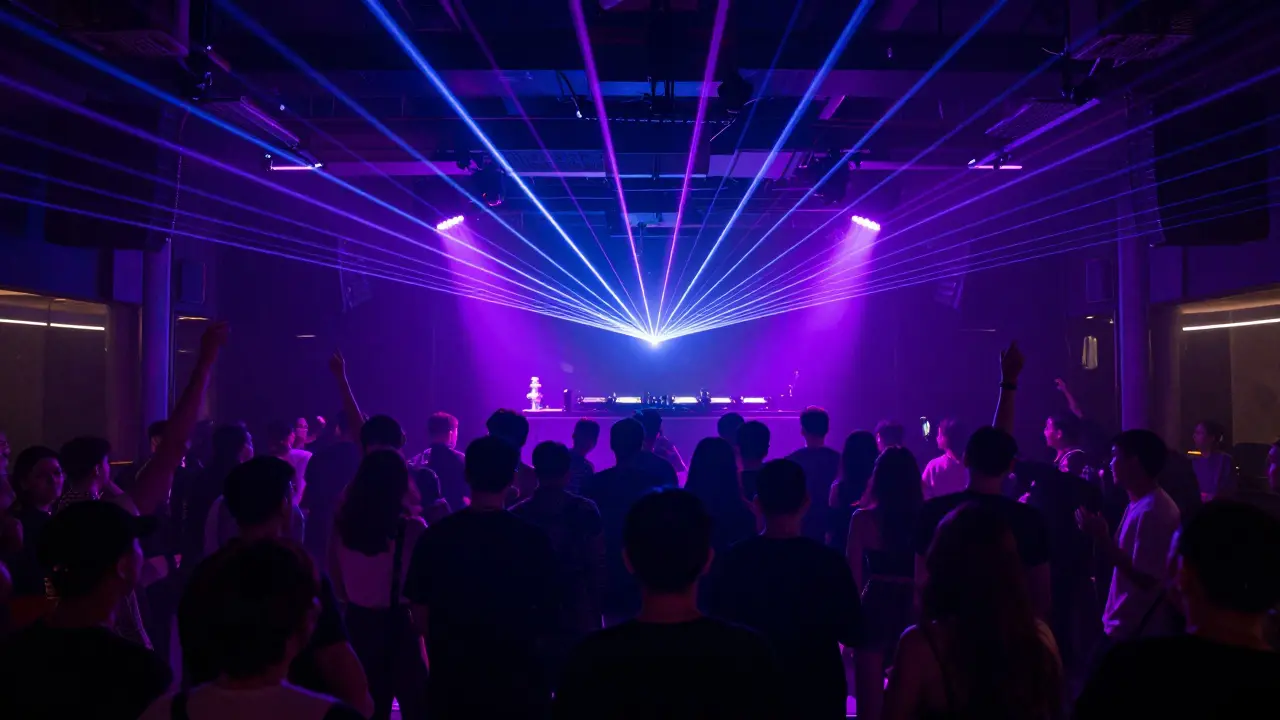 People dancing in a neon-lit electronic music nightclub with lasers.